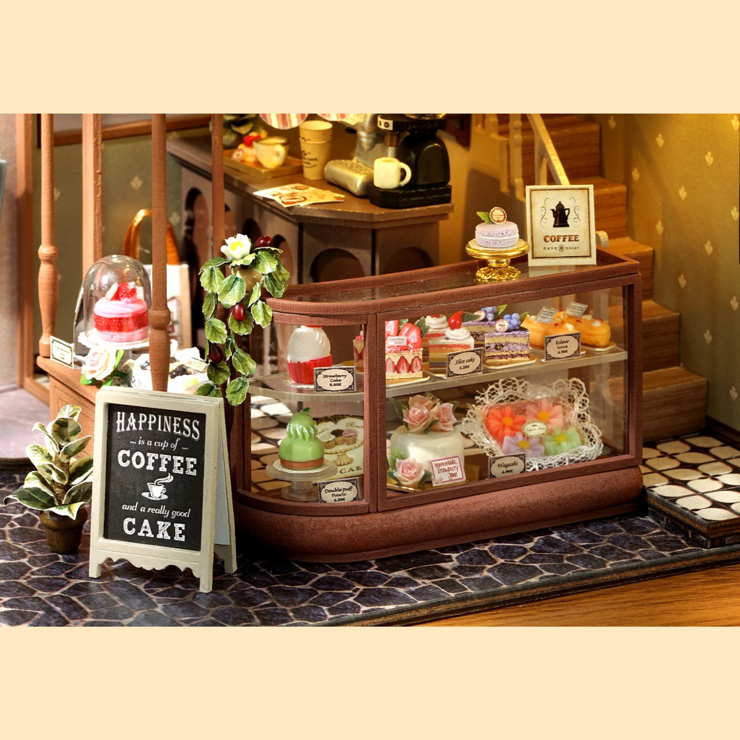 DIY mini house kit “Perch & Latte Loft,” featuring a cozy two-story coffee shop with a glowing café interior, reading nook, lace-curtained loft, and tiny desserts. A warm and detailed build for DIY and crafts lovers and fans of miniature homes.