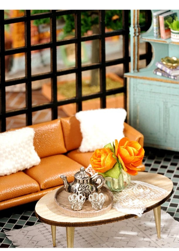 DIY miniature house kit of a two-story garden loft café with spiral stairs, tiny furniture, plants, and glowing lights – perfect for craft ideas, diy and crafts, miniature mansion lovers, and diy miniature home building.