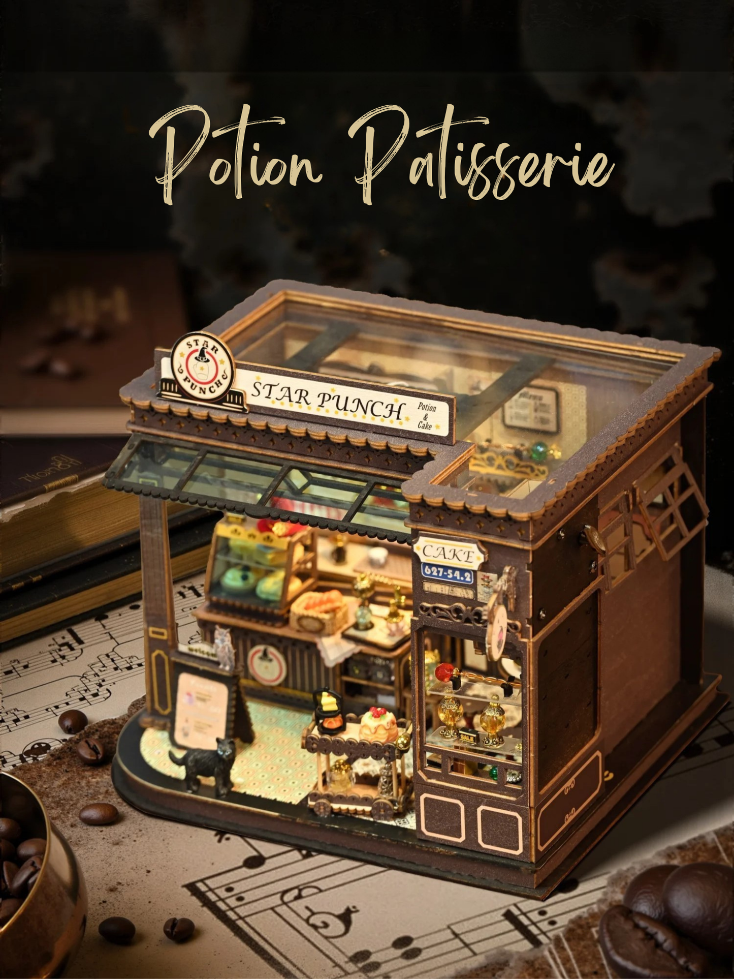 DIY miniature kit featuring “Potion Patisserie,” a whimsical cake and potion shop. Includes magical decor, sweets, golden teapots, and a black cat. Ideal for DIY and crafts lovers, fantasy collectors, and tiny dollhouse hobbyists.