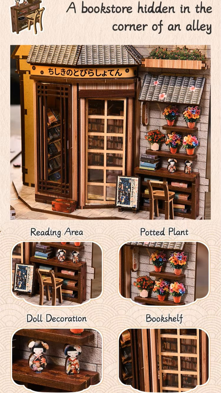 DIY book nook kit “Neko Alley Nook,” featuring a Japanese alleyway with miniature shopfronts, paper lanterns, wooden signage, and lounging cats. A charming DIY and crafts project for Japan enthusiasts and book nook collectors.
