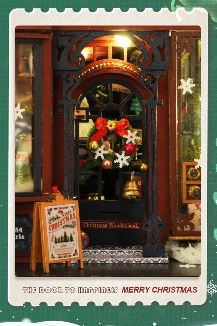 DIY miniature Christmas shop called “Jolly & Pine Christmas Shoppe,” featuring snow-dusted rooftops, holiday lights, a sleigh, Christmas tree, and cozy window displays. Ideal for holiday crafts, DIY mini home kits, and miniature house collectors.
