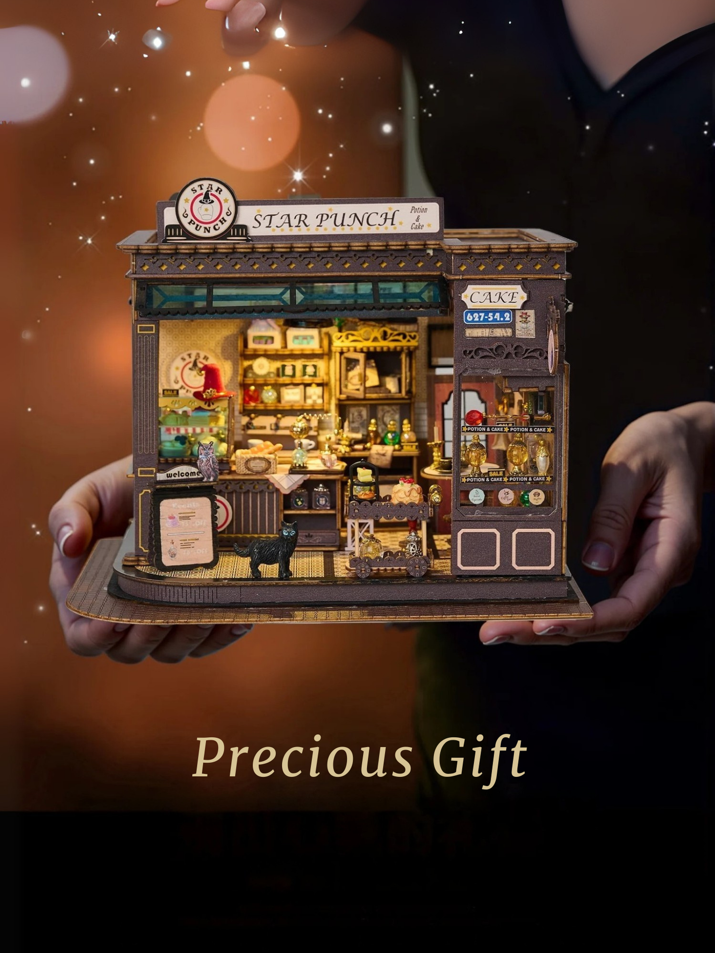DIY miniature kit featuring “Potion Patisserie,” a whimsical cake and potion shop. Includes magical decor, sweets, golden teapots, and a black cat. Ideal for DIY and crafts lovers, fantasy collectors, and tiny dollhouse hobbyists.