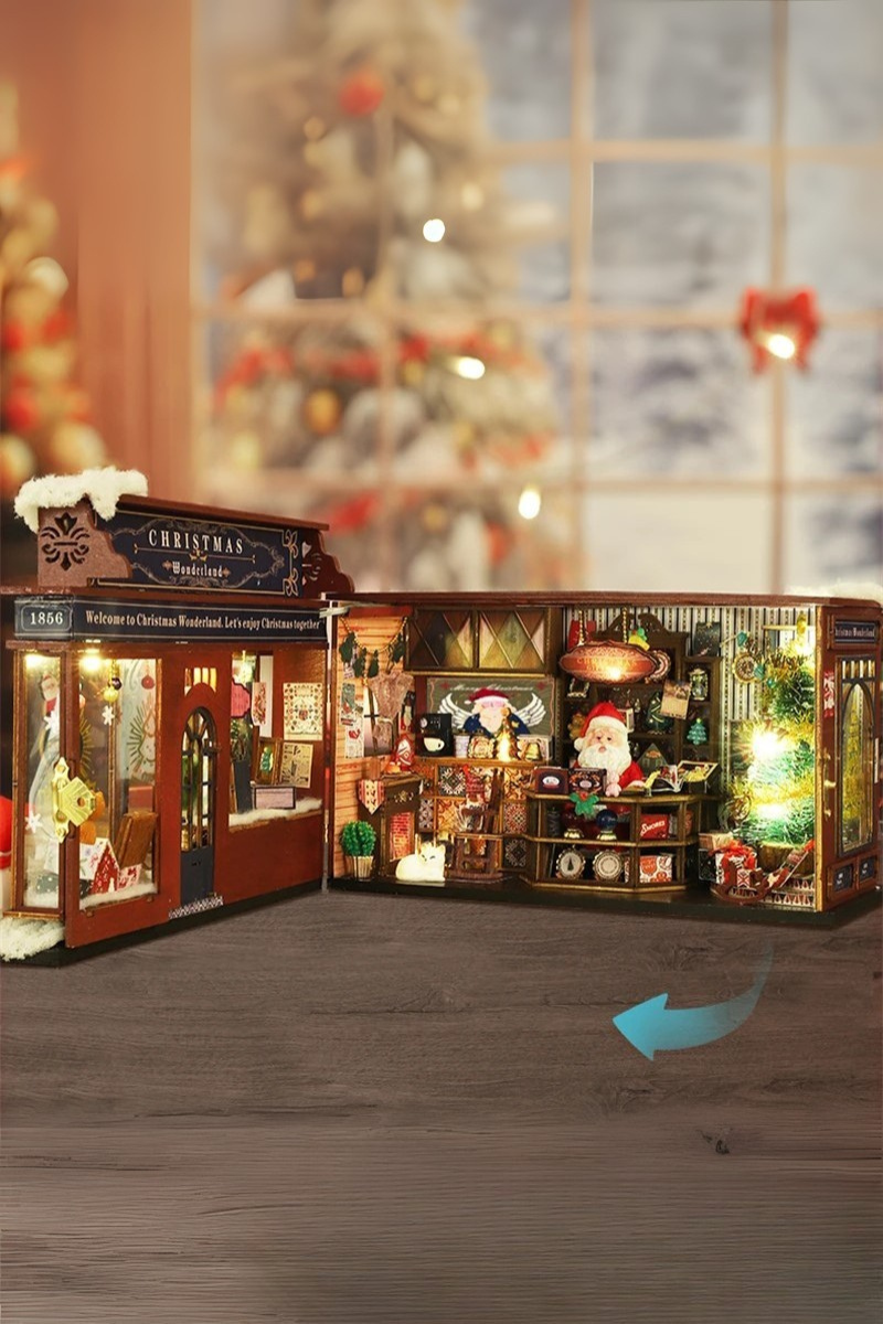 DIY miniature Christmas shop called “Jolly & Pine Christmas Shoppe,” featuring snow-dusted rooftops, holiday lights, a sleigh, Christmas tree, and cozy window displays. Ideal for holiday crafts, DIY mini home kits, and miniature house collectors.