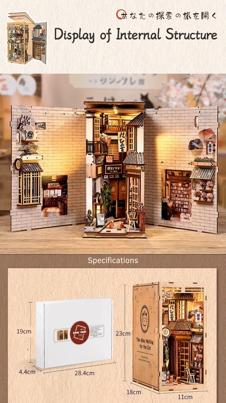 DIY book nook kit “Neko Alley Nook,” featuring a Japanese alleyway with miniature shopfronts, paper lanterns, wooden signage, and lounging cats. A charming DIY and crafts project for Japan enthusiasts and book nook collectors.