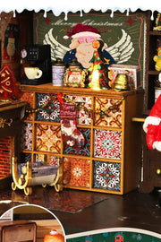 DIY miniature Christmas shop called “Jolly & Pine Christmas Shoppe,” featuring snow-dusted rooftops, holiday lights, a sleigh, Christmas tree, and cozy window displays. Ideal for holiday crafts, DIY mini home kits, and miniature house collectors.