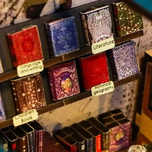 DIY book nook kit featuring a miniature bookstore with tiny books, shelves, cozy lighting, and vintage details — ideal for fans of miniatures, DIY crafts, scale models, and small DIY houses.