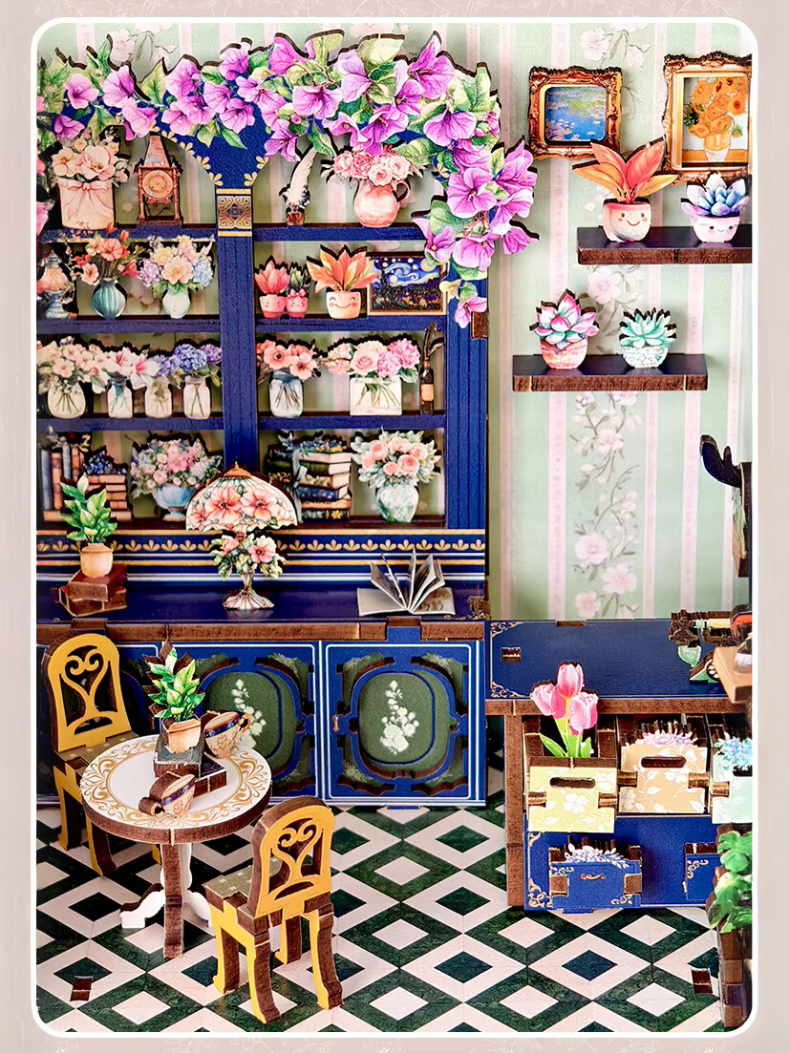 DIY book nook kit “Maison de Fleurs,” featuring a pastel-toned miniature flower shop with arched windows, blooming plants, stone accents, and romantic signage. A relaxing DIY and crafts project for fans of tiny dollhouses and garden-inspired scenes.