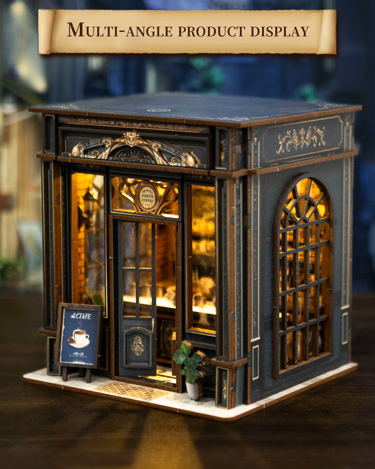 Miniature DIY book nook of a dark vintage-style café with glowing warm lights, ornate black storefront, and a coffee sign that reads “Jadeite Coffee.”