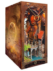 DIY fantasy book nook kit featuring a dragon-themed miniature valley with stone bridges, rooftops, and glowing landscape — ideal for miniature fans, DIY crafts, and book nook collectors.