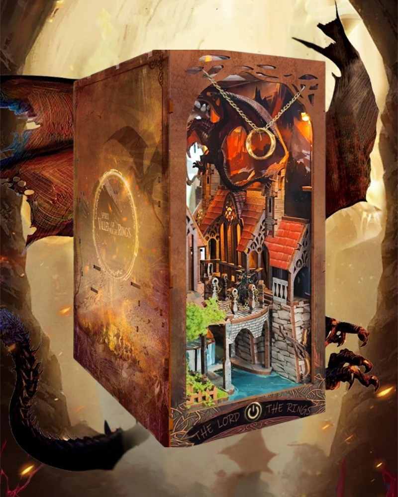 DIY fantasy book nook kit featuring a dragon-themed miniature valley with stone bridges, rooftops, and glowing landscape — ideal for miniature fans, DIY crafts, and book nook collectors.