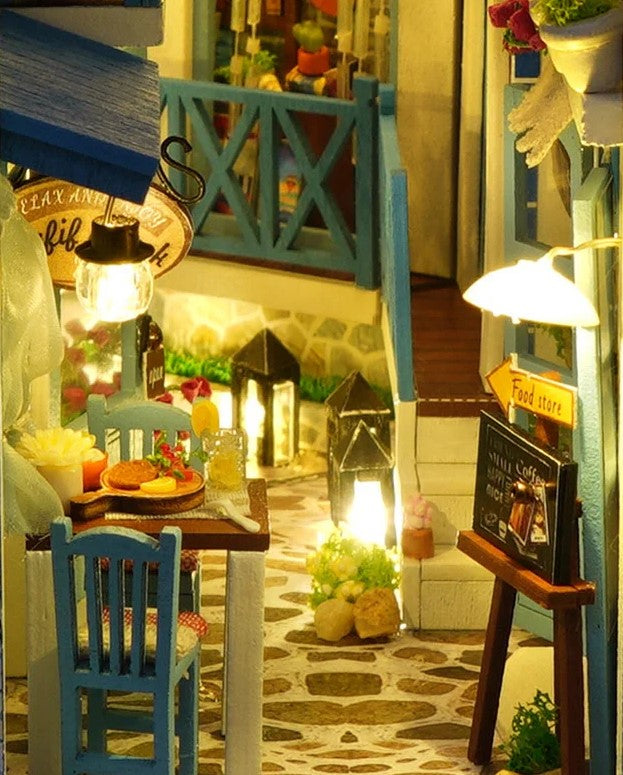 DIY and crafts lovers will enjoy this miniature book nook kit — a charming Mediterranean street scene that doubles as a bookshelf insert or home decor; perfect for craft ideas and making miniatures.