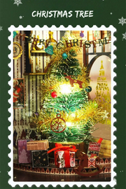 DIY miniature Christmas shop called “Jolly & Pine Christmas Shoppe,” featuring snow-dusted rooftops, holiday lights, a sleigh, Christmas tree, and cozy window displays. Ideal for holiday crafts, DIY mini home kits, and miniature house collectors.