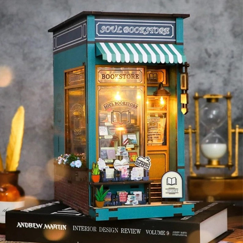 DIY book nook kit featuring a miniature bookstore with tiny books, shelves, cozy lighting, and vintage details — ideal for fans of miniatures, DIY crafts, scale models, and small DIY houses.