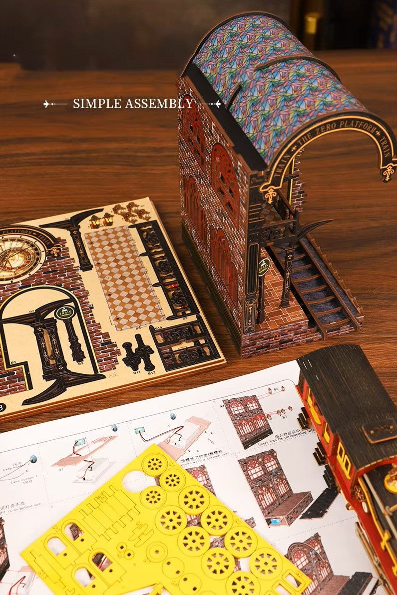 DIY book nook kit “Platform Arcane,” featuring a mechanical fantasy train station with glowing lights, gears, arched glass roof, red locomotive, and magical details. Ideal for DIY and crafts lovers, fantasy readers, and miniature train enthusiasts.