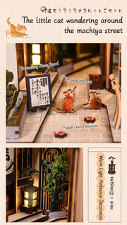 DIY book nook kit “Neko Alley Nook,” featuring a Japanese alleyway with miniature shopfronts, paper lanterns, wooden signage, and lounging cats. A charming DIY and crafts project for Japan enthusiasts and book nook collectors.