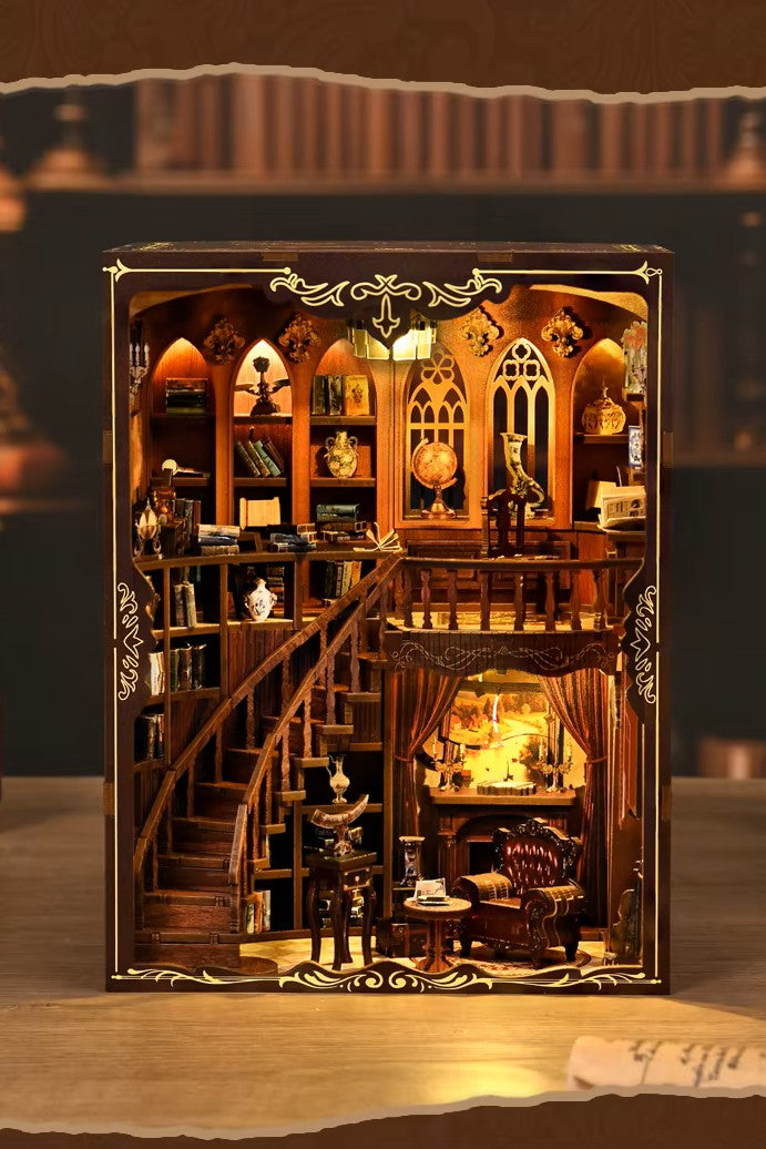 DIY book nook of an antique library scene with gothic-style arches, spiral stairs, a cozy reading nook, and glowing lamplight, styled in dark academia tones.