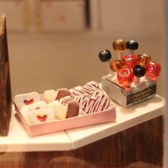 DIY miniature chocolate shop kit – a tiny dollhouse-style chocolatier with LED lights, perfect for book nook lovers, miniature mansion collectors, and fans of DIY crafts, miniatures, and small DIY houses.