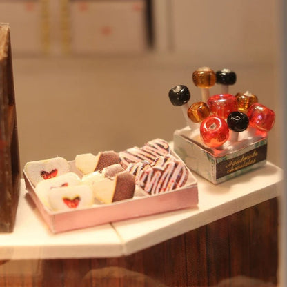 DIY miniature chocolate shop kit – a tiny dollhouse-style chocolatier with LED lights, perfect for book nook lovers, miniature mansion collectors, and fans of DIY crafts, miniatures, and small DIY houses.