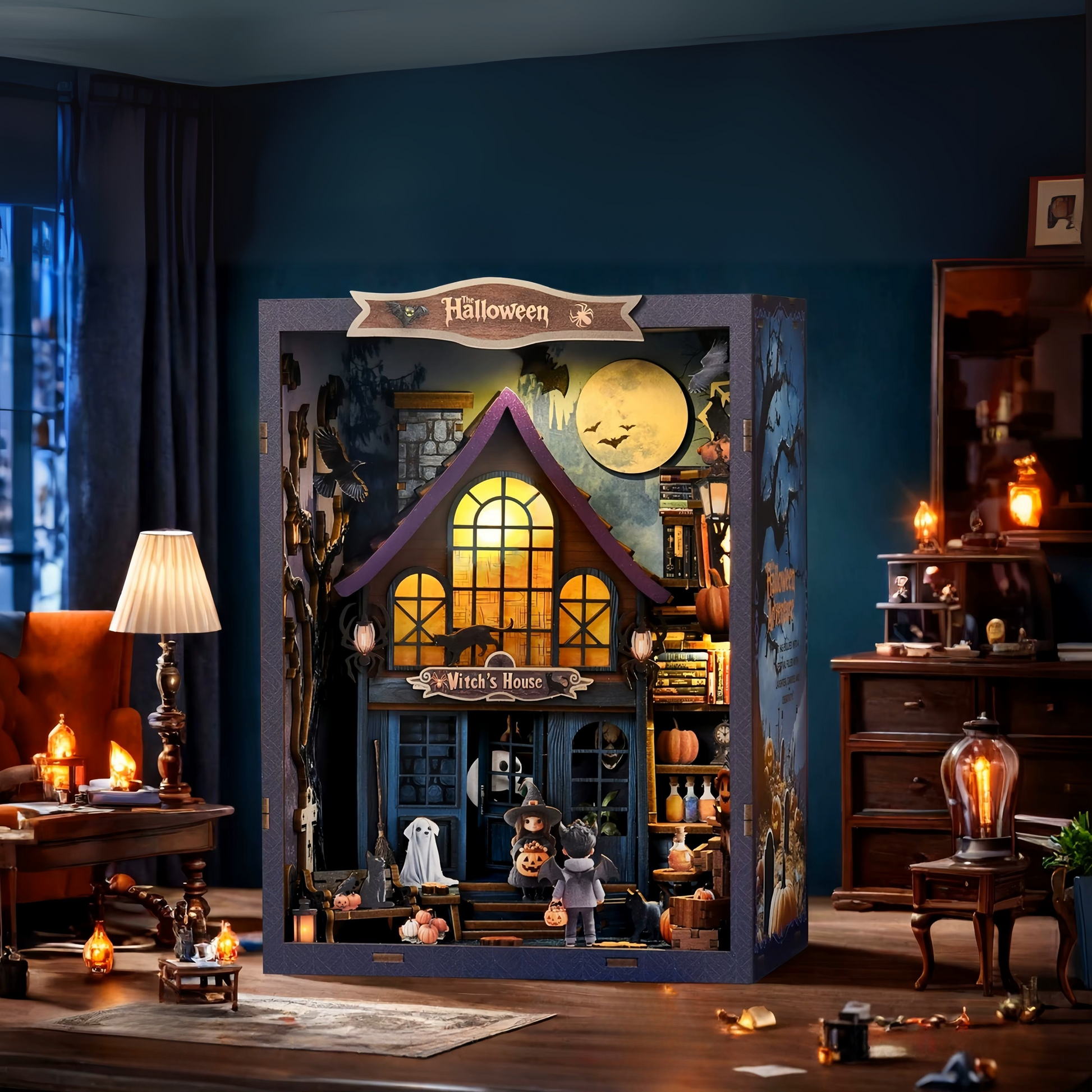 DIY book nook kit “Pumpkin Trick-or-Treat,” featuring a witch’s house with glowing windows, jack-o’-lanterns, trick-or-treaters, bats, and Halloween decorations. A festive miniature for DIY and crafts lovers and seasonal book nook collectors.