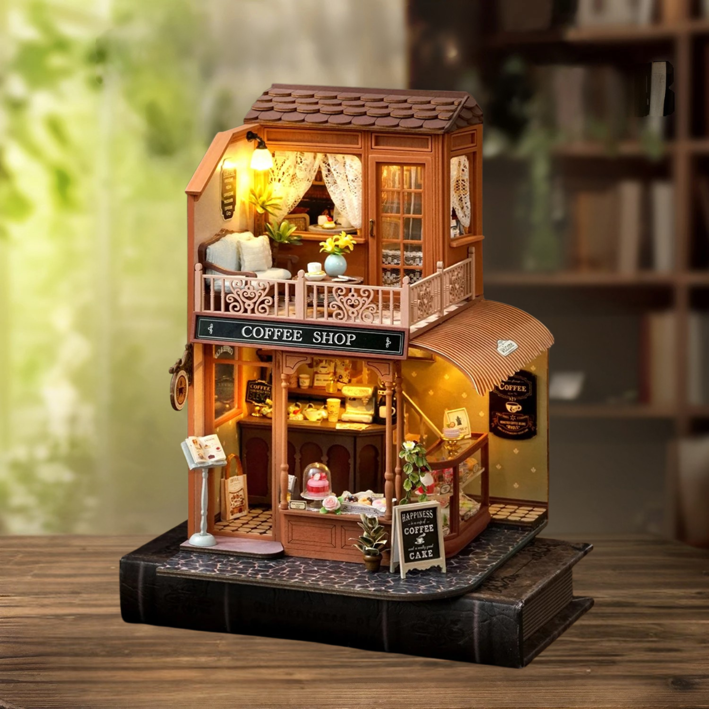 DIY mini house kit “Perch & Latte Loft,” featuring a cozy two-story coffee shop with a glowing café interior, reading nook, lace-curtained loft, and tiny desserts. A warm and detailed build for DIY and crafts lovers and fans of miniature homes.