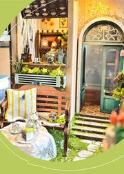 DIY garden book nook kit featuring a miniature outdoor café, greenery, tiny table setup, and rustic path — perfect for miniature lovers, DIY crafts, book nook fans, and small DIY house decor.
