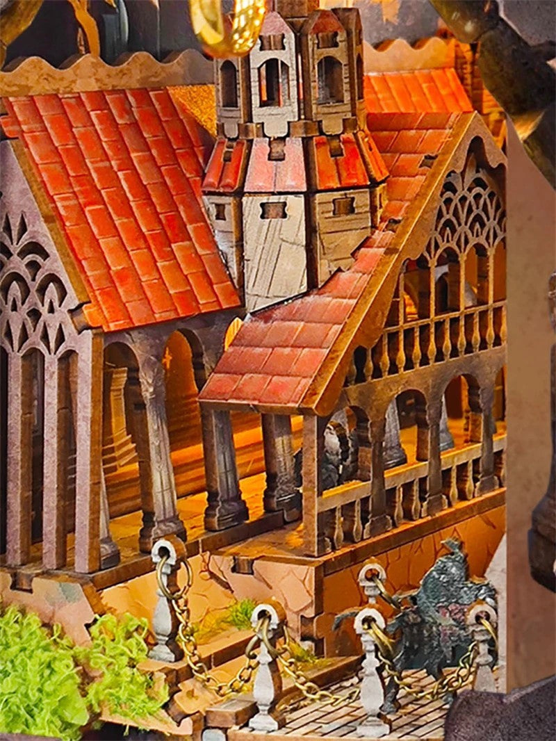 DIY fantasy book nook kit featuring a dragon-themed miniature valley with stone bridges, rooftops, and glowing landscape — ideal for miniature fans, DIY crafts, and book nook collectors.