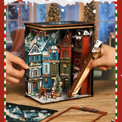 DIY book nook kit “Merry Market Lane,” featuring a warmly lit winter street with festive storefronts, snow-topped rooftops, and a softly bustling holiday vibe. A detailed DIY and crafts project perfect for holiday lovers and miniature collectors.