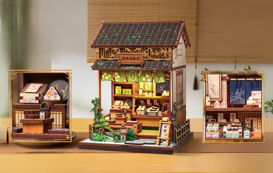 DIY mini house kit “Japanese Sweets Store,” featuring a traditional candy and wagashi shop with miniature desserts, wooden shelves, hanging banners, and tiny gift boxes. A detailed DIY and crafts project perfect for fans of Japanese culture and making miniatures.
