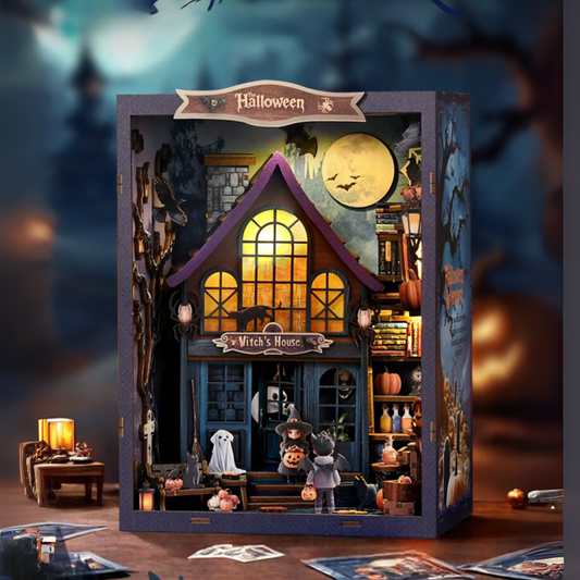 DIY book nook kit “Pumpkin Trick-or-Treat,” featuring a witch’s house with glowing windows, jack-o’-lanterns, trick-or-treaters, bats, and Halloween decorations. A festive miniature for DIY and crafts lovers and seasonal book nook collectors.