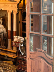 DIY miniature house kit styled as an Athenaeum library with classical columns, bookshelves, and warm lighting in an old-world study.