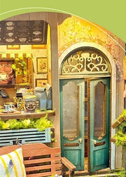 DIY garden book nook kit featuring a miniature outdoor café, greenery, tiny table setup, and rustic path — perfect for miniature lovers, DIY crafts, book nook fans, and small DIY house decor.