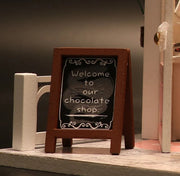 DIY miniature chocolate shop kit – a tiny dollhouse-style chocolatier with LED lights, perfect for book nook lovers, miniature mansion collectors, and fans of DIY crafts, miniatures, and small DIY houses.