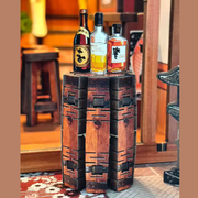 DIY miniature sake bar book nook with glowing lanterns, wooden bar seating, bamboo paneling, and rows of sake bottles, capturing the quiet atmosphere of a late-night Japanese tavern.