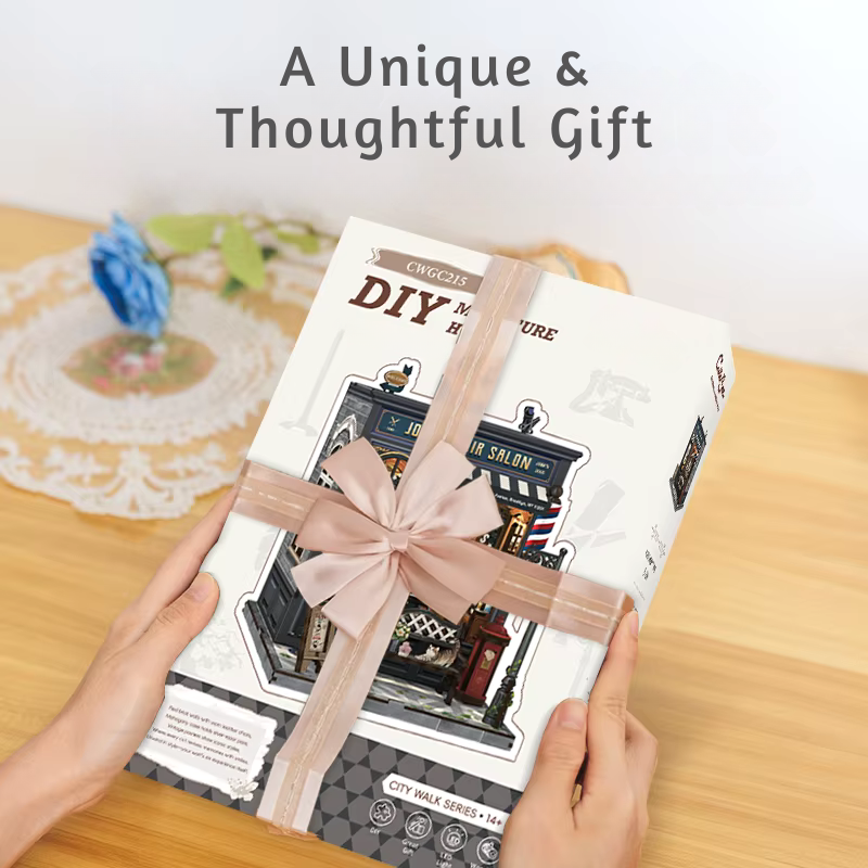 DIY book nook kit “Pomade Parlor,” featuring a vintage barbershop and hair salon interior with red chairs, mirrors, wooden shelves, and miniature grooming tools. A nostalgic DIY and crafts project for fans of retro style, miniatures, and classic salon design.