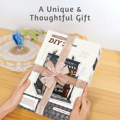 DIY book nook kit “Pomade Parlor,” featuring a vintage barbershop and hair salon interior with red chairs, mirrors, wooden shelves, and miniature grooming tools. A nostalgic DIY and crafts project for fans of retro style, miniatures, and classic salon design.