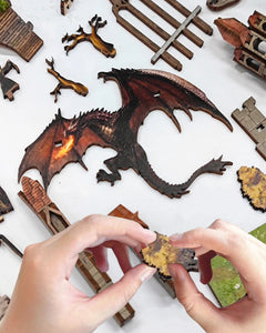 DIY fantasy book nook kit featuring a dragon-themed miniature valley with stone bridges, rooftops, and glowing landscape — ideal for miniature fans, DIY crafts, and book nook collectors.