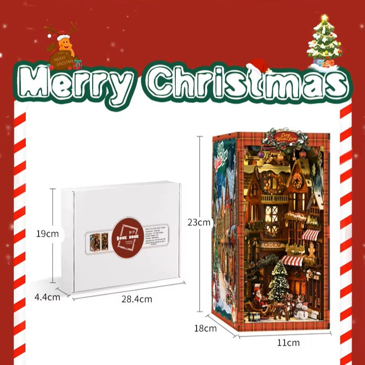 DIY book nook kit “Merry Market Lane,” featuring a warmly lit winter street with festive storefronts, snow-topped rooftops, and a softly bustling holiday vibe. A detailed DIY and crafts project perfect for holiday lovers and miniature collectors.