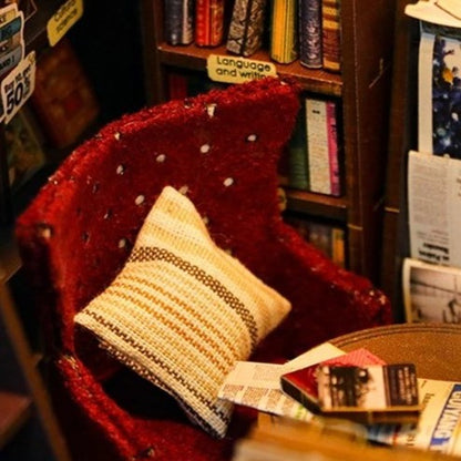 DIY book nook kit featuring a miniature bookstore with tiny books, shelves, cozy lighting, and vintage details — ideal for fans of miniatures, DIY crafts, scale models, and small DIY houses.
