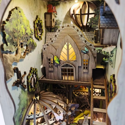 DIY book nook kit “Woodland Tales,” inspired by The Wizard of Oz. Features a glowing forest path with Dorothy and whimsical forest details. A magical DIY craft project for fans of storybook miniatures and fantasy-themed book nooks.