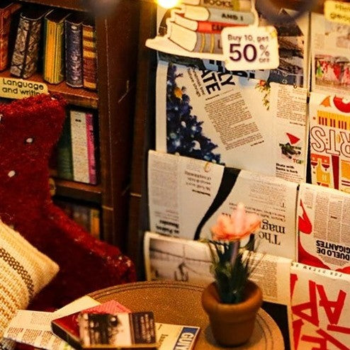 DIY book nook kit featuring a miniature bookstore with tiny books, shelves, cozy lighting, and vintage details — ideal for fans of miniatures, DIY crafts, scale models, and small DIY houses.