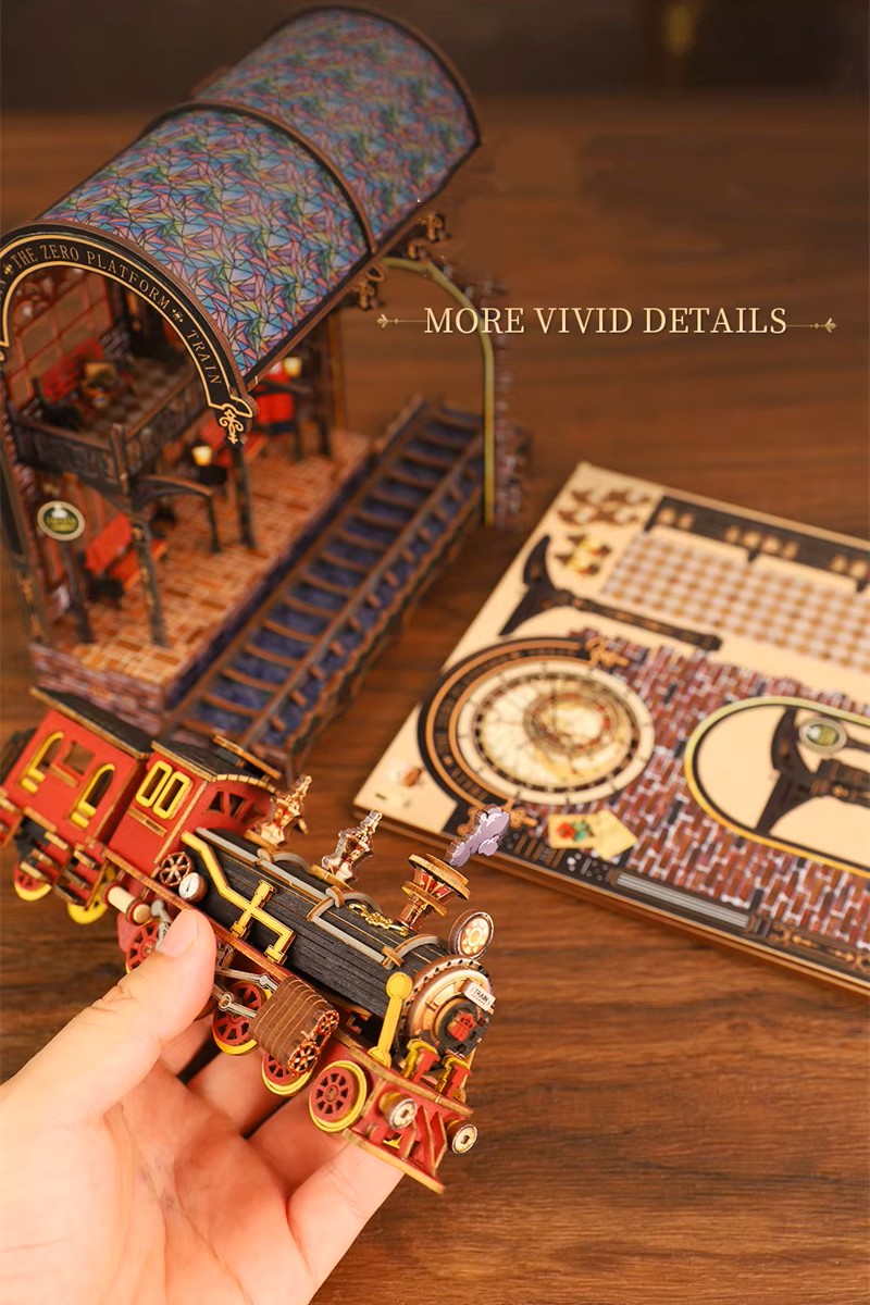 DIY book nook kit “Platform Arcane,” featuring a mechanical fantasy train station with glowing lights, gears, arched glass roof, red locomotive, and magical details. Ideal for DIY and crafts lovers, fantasy readers, and miniature train enthusiasts.