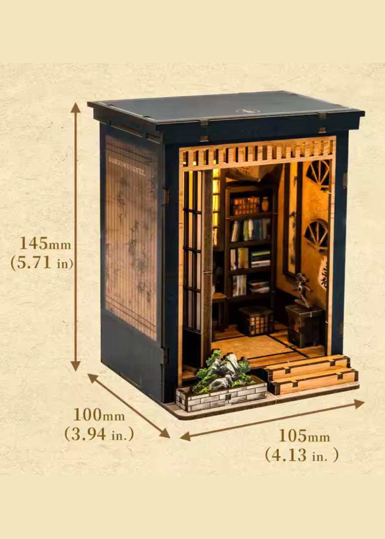DIY book nook of a Japanese-style tea alcove featuring a glowing paper lantern, bonsai rock garden, shoji screen doors, bookshelves, and a peaceful wooden table, evoking the quiet ambiance of a neighborhood tea house.