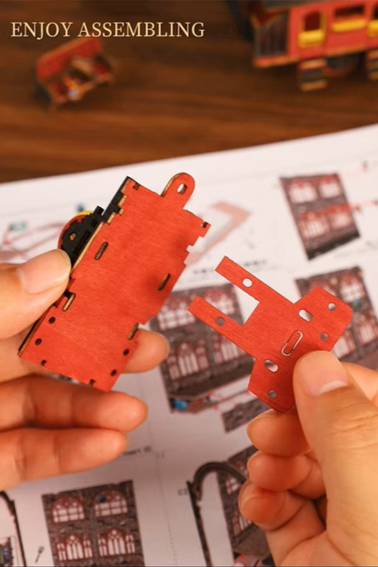 DIY book nook kit “Platform Arcane,” featuring a mechanical fantasy train station with glowing lights, gears, arched glass roof, red locomotive, and magical details. Ideal for DIY and crafts lovers, fantasy readers, and miniature train enthusiasts.