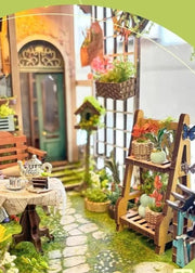 DIY garden book nook kit featuring a miniature outdoor café, greenery, tiny table setup, and rustic path — perfect for miniature lovers, DIY crafts, book nook fans, and small DIY house decor.