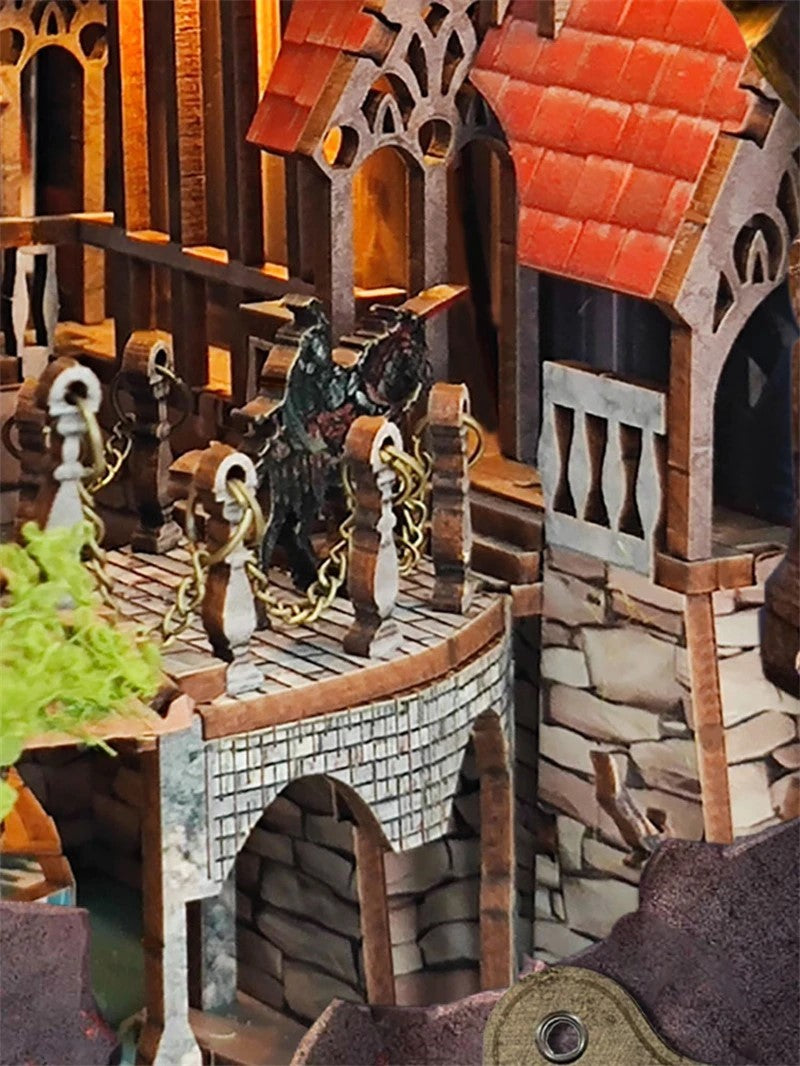 DIY fantasy book nook kit featuring a dragon-themed miniature valley with stone bridges, rooftops, and glowing landscape — ideal for miniature fans, DIY crafts, and book nook collectors.