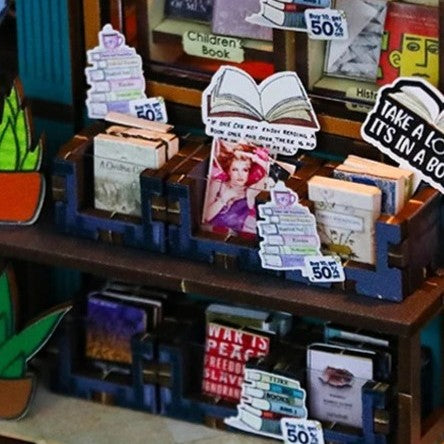 DIY book nook kit featuring a miniature bookstore with tiny books, shelves, cozy lighting, and vintage details — ideal for fans of miniatures, DIY crafts, scale models, and small DIY houses.