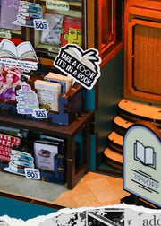 DIY book nook kit featuring a miniature bookstore with tiny books, shelves, cozy lighting, and vintage details — ideal for fans of miniatures, DIY crafts, scale models, and small DIY houses.