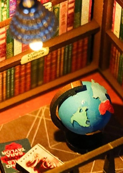 DIY book nook kit featuring a miniature bookstore with tiny books, shelves, cozy lighting, and vintage details — ideal for fans of miniatures, DIY crafts, scale models, and small DIY houses.