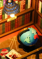 DIY book nook kit featuring a miniature bookstore with tiny books, shelves, cozy lighting, and vintage details — ideal for fans of miniatures, DIY crafts, scale models, and small DIY houses.