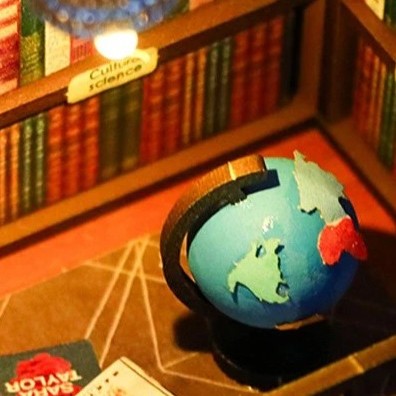 DIY book nook kit featuring a miniature bookstore with tiny books, shelves, cozy lighting, and vintage details — ideal for fans of miniatures, DIY crafts, scale models, and small DIY houses.